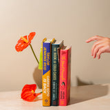 Sight, hand reaching for 3 book options